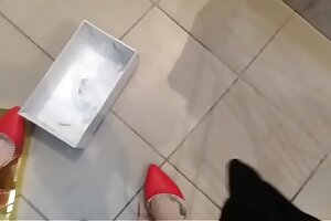 Spy on your sexy mom's sweaty feet while changing some different shoes in the store